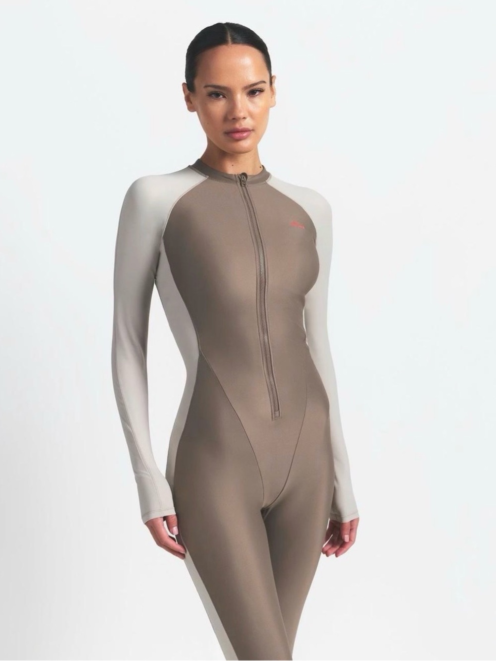 SKIMS Two-Tone Zip-Front Performance Catsuit — Taupe & Off-White - Picture 1 of 3